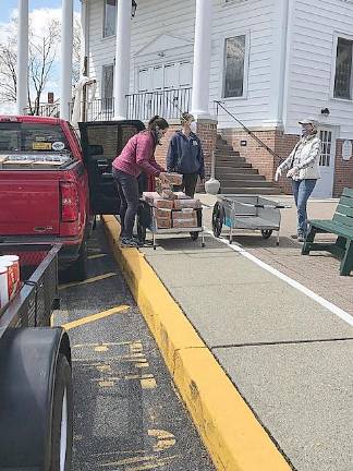 Volunteers with the Sparta Ecumenical Food Pantry distribute food (Photo provided)