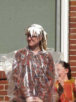 Pies on Pi Day Cindy Gunderman of Ogdensburg, resources staff, hit by Frankie Ciasullo.