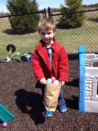 Luke shows off his Easter egg haul.