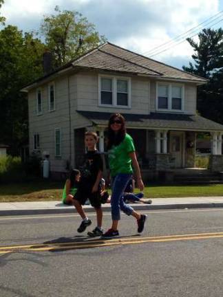Lisa Sears&#xa0;and her son, Christian,&#xa0;walk down the parade path.&#xa0;