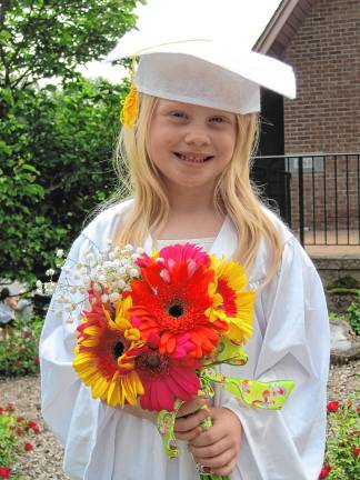 Preschool’s last graduation PR3 Charlotte Cady, 5, at the preschool graduation.