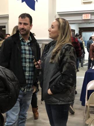 UPDATE: School board removes book from middle school Christina Korines, right, complained to Sparta school officials about “The Upside of Unrequited,” which the school board removed from the middle school library at its meeting Feb. 23.