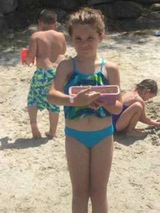Addison enjoys the beach