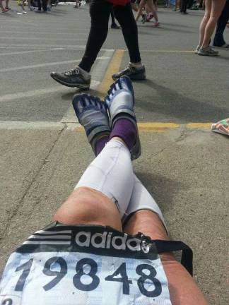 Local runners are Boston bound Photo by Karl Fenske Karl snaps a photo of his sneakers before running the Boston Marathon in 2013.