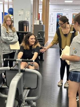 YMCA helps students get fit Y1 Reagan Darvalics, Brooklyn Nunes and Emma Dutko are assisted by Alma Dhuyvetter, a senior health, wellness and sports director at the Sussex County Y in Hardyston. (Photos provided by Mollie Shauger)