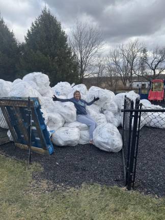 When in doubt, give a shout: Reusable shopping bags? Nelly Maccaro of the Sparta Community Food Pantry with a load of reusable bags on the way to the recycler, Goatote in Hackettstown.