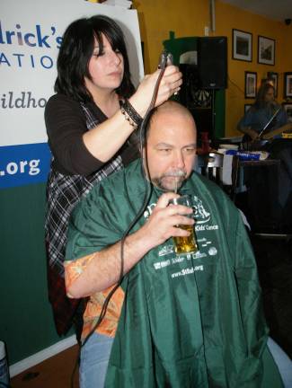 Irish Cottage Inn hosts St. Baldrick's fundraiser Dale Meyer of Vernon gets a trim by haircutter Stacy Dolan of FranklinþÄôs Rumours II. Meyer raised nearly $500 to aid the fight against childrenþÄôs cancer.