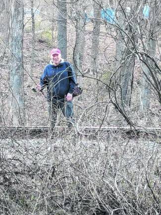 Bill Truran walks along the rails on the east side of the Wallkill River to get to a special fishing spot. (Photo by Earl Hornyak)