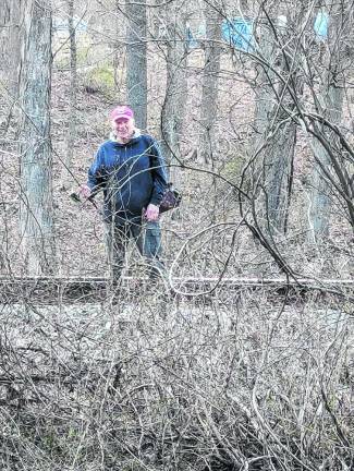 Sussex County History Today: ‘Fishin’ Blues’ Bill Truran walks along the rails on the east side of the Wallkill River to get to a special fishing spot. (Photo by Earl Hornyak)