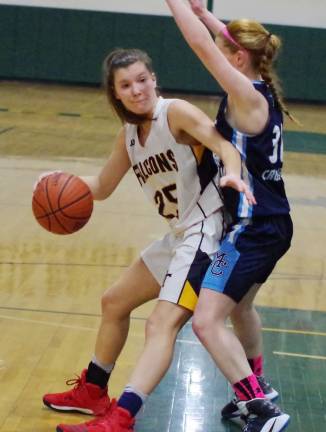 Jefferson's Victoria Pietraszkiewicz dribbles the ball while covered by Morris Catholic's Emily Schum.