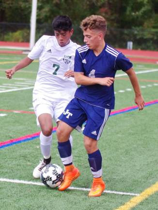 Jefferson's Hunter Jacobus battles Morris Knolls Brian Perez for control of the ball. Morris Knolls High School defeated Jefferson Township High School (Oak Ridge, N.J.) in boys varsity soccer on Sunday, October 8, 2017. The final score was 6-1. The Morris County Tournament, Quarterfinal Round took place at Morris Knolls High School in Rockaway, New Jersey.