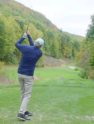 Crystal Cup golfer David Frank hits his tee shot on the beautiful 12th hole at Black Bear Golf Club.