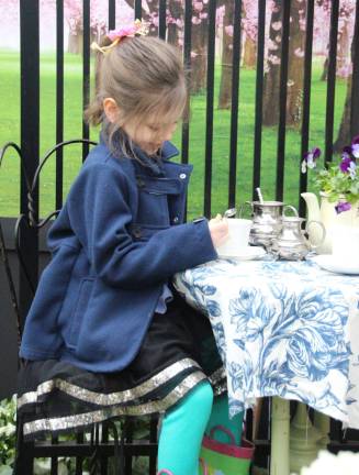 Adelaide Curtis enjoys a play tea party courtesy of TNT Fencing at Springfest