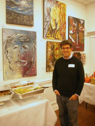Skylands Gallery show benefits Father John's Animal House John Maione Jr. stands in front of some of his paintings. Top chef Orlando from FratelloþÄôs provided the accompanying feast.