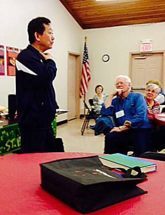 Grandmaster Kim is shown with Frankford Township seniors President Dona McMillen