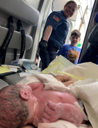 Police officer delivers baby on Route 23 Officer Antonucci and brother Wyatt meet baby Juliana. Photo provided.