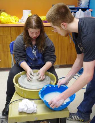 Sierra Slate, 19, a Sussex County Community College student, enjoyed her potter&#xfe;&#xc4;&#xf4;s wheel-throwing lesson given by Vernon Township High School junior James Schamble, 17 (not shown).
