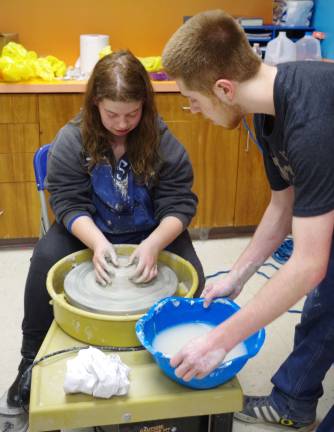 The show must go on Sierra Slate, 19, a Sussex County Community College student, enjoyed her potterþÄôs wheel-throwing lesson given by Vernon Township High School junior James Schamble, 17 (not shown).