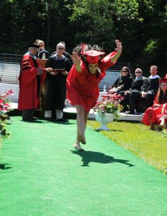 Hi-jinks at High Point graduation Taylor Welsh, cartwheel in progress.