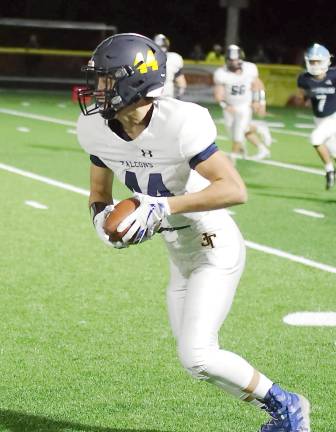 Jefferson wide receiver Joseph Altamura is on the move with the ball in the first half.