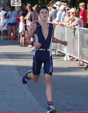 Liam Mchale, 16, of Sparta reaches the finish line in 23rd place with a time of 1:12:52. Mchale finished in third place in the male 19 and under category with a time of 1:12:52.58.