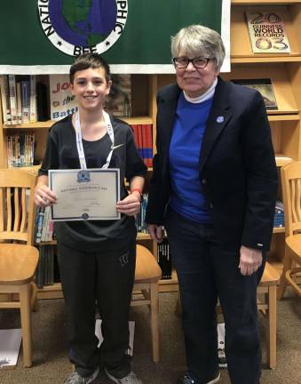 Max Mazzatta, a seventh-grader at Hilltop Country Day School from Sandyston, was crowned school champion during the National Geographic Society Geo Bee and advances to the state level competition. Pictured with middle school history teacher Nan Katzenbach.