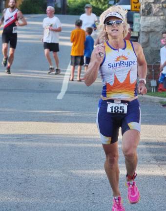 Tracey Swenson of Sparta Township finished in 28th place overall with a time of 1:13:54. She also finished first in the female 50-54 age category with the time of 1:13:54.56.