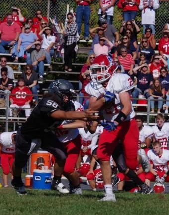 A Wallkill Valley defender reaches for a Lenape Valley ball carrier.