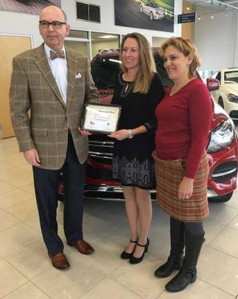 Auto dealerships contribute to Valerie Fund Tim Allocca and Cheryl Eichner of Intercar Mercedes are shown with Bunny Flanders of the Valerie Fund.