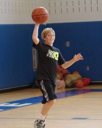 Crossroads basketball camp comes to area Matthew Hermes, 10, of Newton, is shown with the ball.