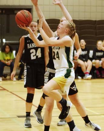 Veritas Christian's Kayla Amels in the midst of a shot in the fourth period. Amels scored 4 points.