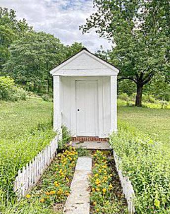The Greek Revival privy on the museum grounds that served as the model for the new Little Free Library (Photo submitted by the Chinkchewunska Chapter, DAR)