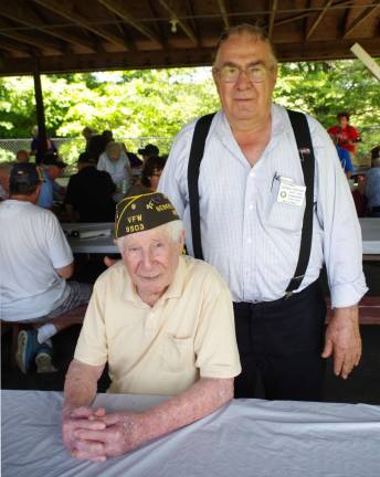 Herman Terpstra, a former American Legion State Deputy Vice Commander stands behind a very special veteran, 99-year-old World War II veteran Walter S. Atchison, a resident at Bristol Glen in Newton. A celebration of his birthday is planned for September 27.