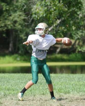 Sussex Tech Mustangs quarterback Tyler Crum sets to throw on Monday August 15, 2016 at Harmony Ridge Campgrounds in Branchville.