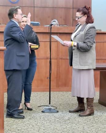 Carl Miller is sworn in as deputy mayor.