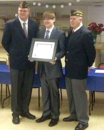 Austin Oleksy, a senior at Wallkill Valley Regional High School, is shown with Commander Stephen L. Davis and VFW Chairman Donald E. DeVore.