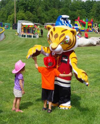 This tiger mascot from Master Ken&#xfe;&#xc4;&#xf4;s Xtreme Martial Arts Center was a big hit with the kids.