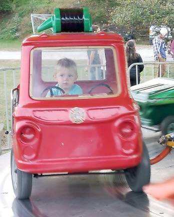 Richie loved riding in the red fire truck and is looking forward to seeing the fire trucks during the Annual Sussex County Firemen’s Association Inspection Day and Parade