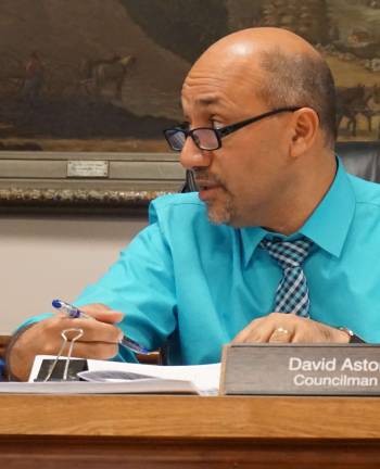 PHOTOS BY VERA OLINSKI Councilman DAvid Astor discusses details regarding the garbage contract.