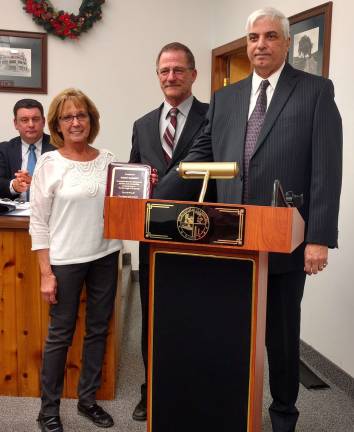 Deputy Clerk Kathy Garrett receives her Service Award from Mayor Paul Marino (right) and council member Ron Garrett.