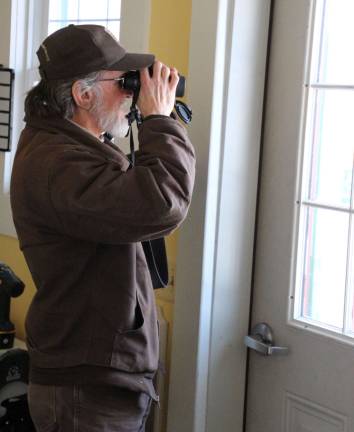 U.S. Official Wildlife Service member Ken Witkowski identifying local birds.
