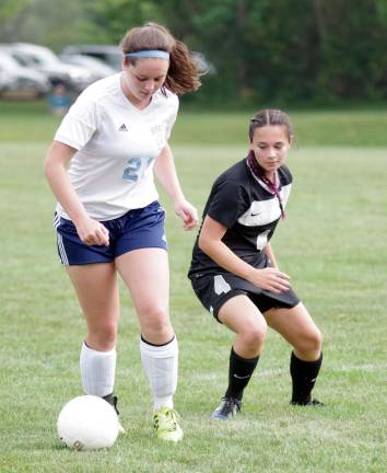 Sparta's Hannah Lyden is shadowed by Wallkill Valley's Lia Pila.