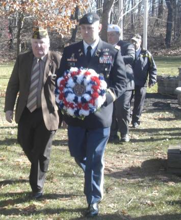 Commander Michael Murphy of VFW Post 564 and LTC Jeffrey Ivey of Picatinny Arsenal prepare to lay a wreath at the monument honoring Jefferson Township residents who are currently in the Military and Veterans who have served in the Desert Storm era fighting terrorism.