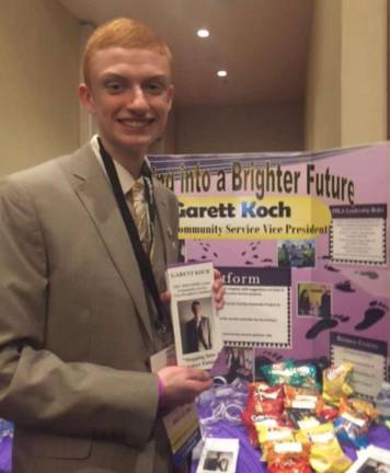 Wallkill Valley FBLA member Garett Koch sets up his campaign booth for Community Service Vice President at the 2017 FBLA State Leadership Conference.