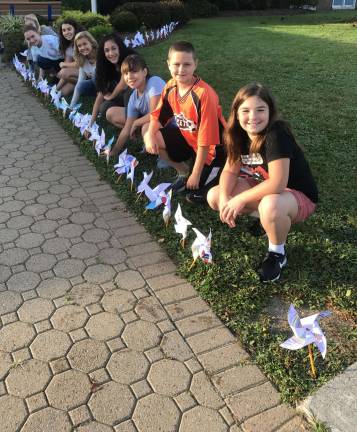 Lafayette students paint pinwheels for peace