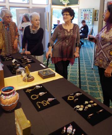 Artist Dawn McLaughlin, center, exhibited sculptures and jewelry at the Highland Lakes Professional Artists&#xfe;&#xc4;&#xf4; Show.