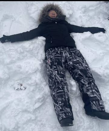 Alice Kimble, 99, of Sparta makes a snow angel. (Photo provided)