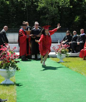 Hi-jinks at High Point graduation Taylor Welsh begins a carthwheel to mark her graduation from High Point High. Photos by Nicholas Ortiz