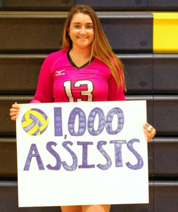 Jefferson's Hannah Carcich poses for a portrait after achieving her 1,000th assist. Carcich achieved her 1,000th career assist during the second set.