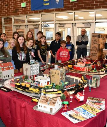 RR4 Sixth-graders watch a display of model trains set up in the school lobby.